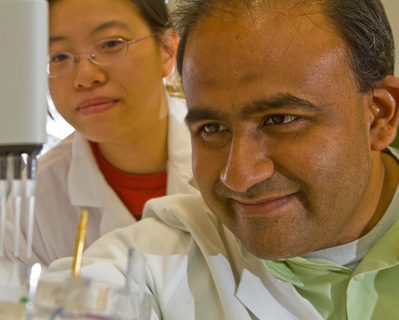 Anand looking at lab equipments